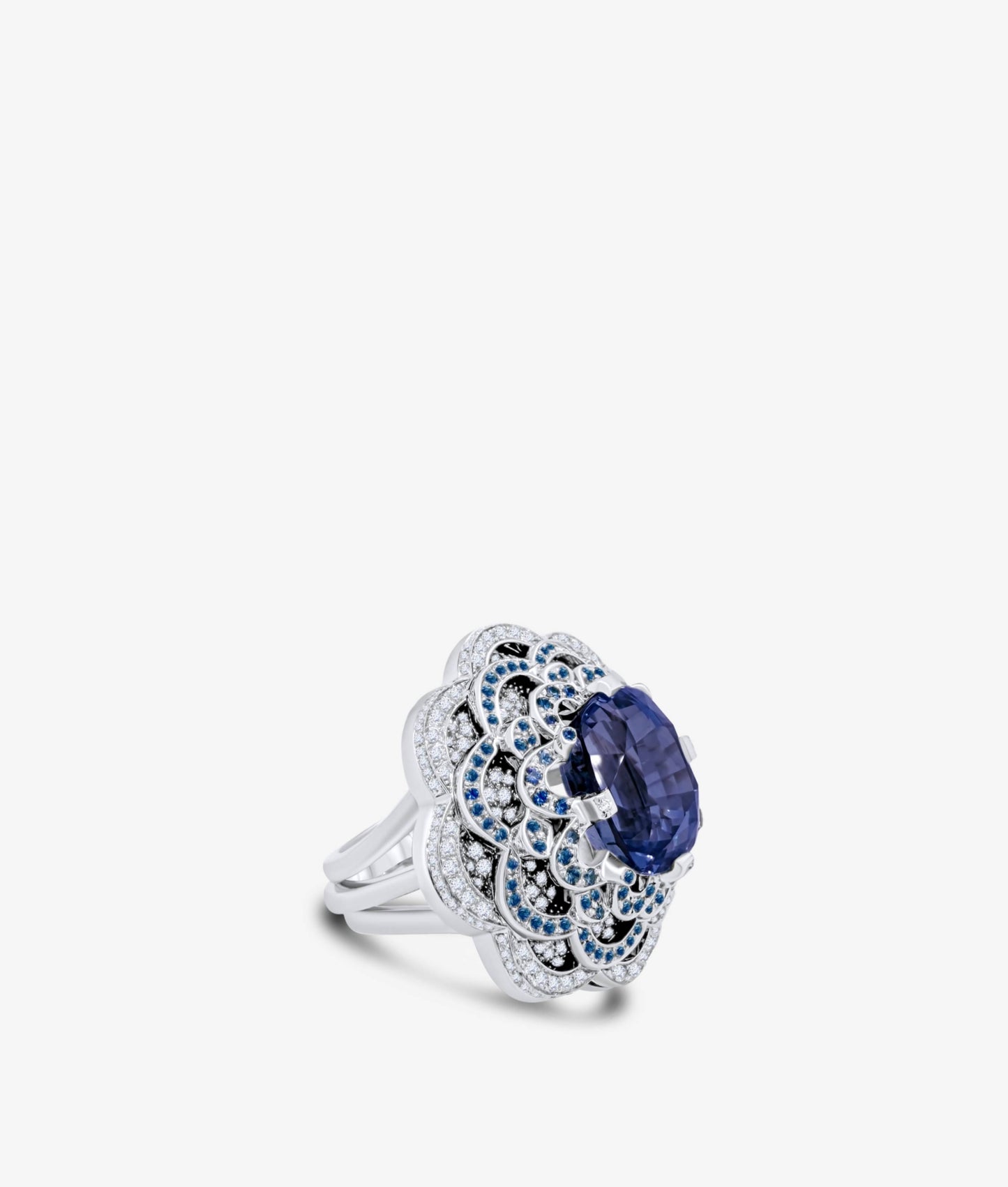 Cushion cut Sapphire set on a Flower Bed of Sapphires and Diamonds