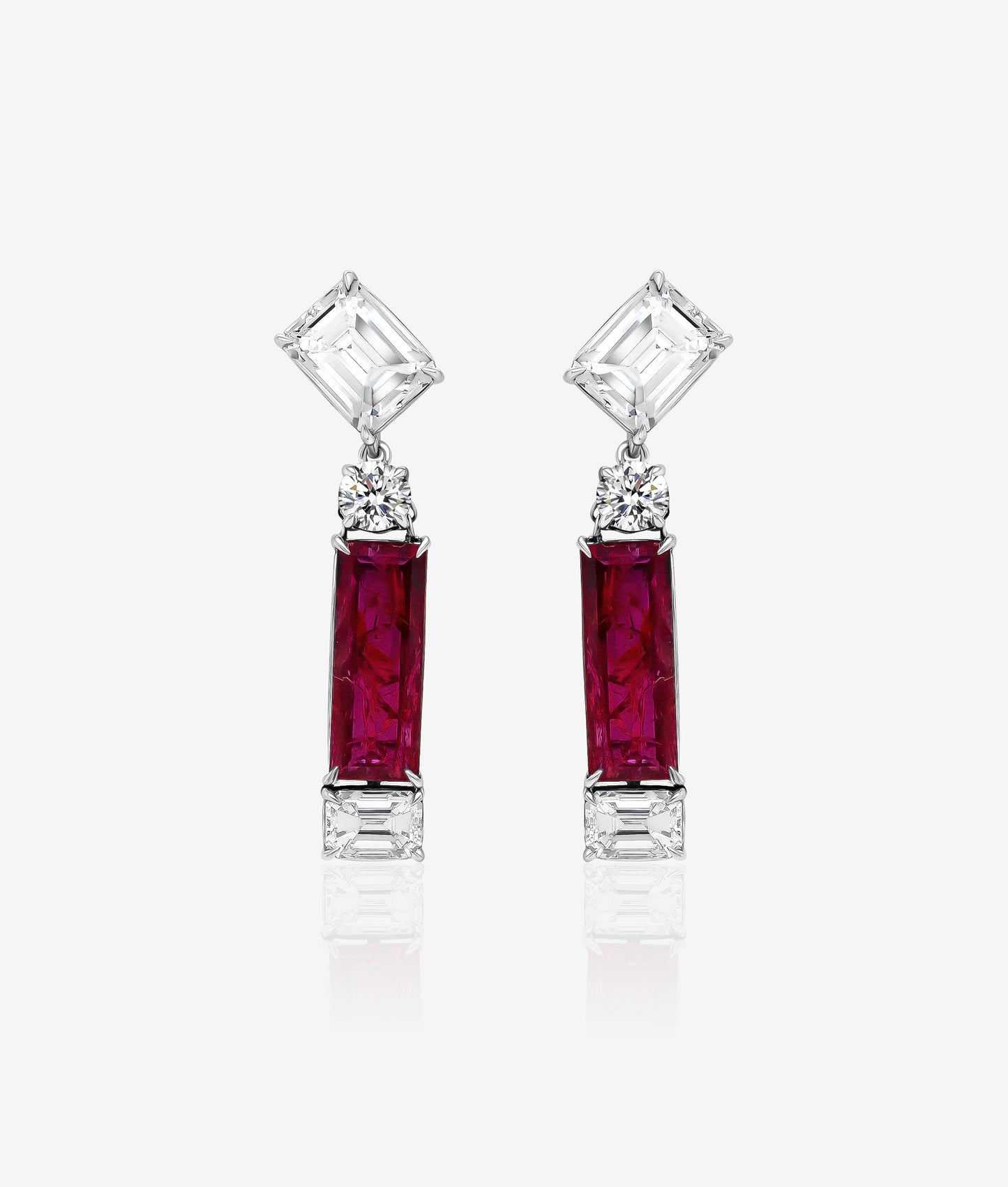 Rectangular ruby earrings with emerald cut diamond tops